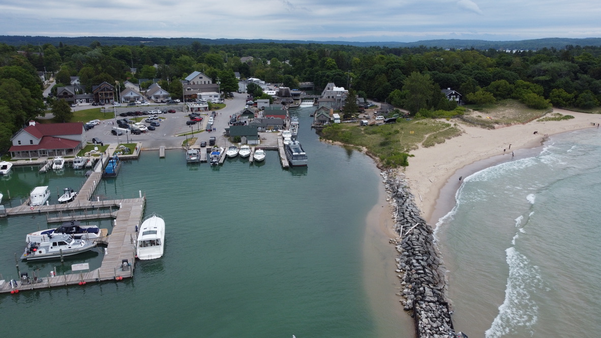 Aerial view of the Leland harbor and Fishtown near the beach