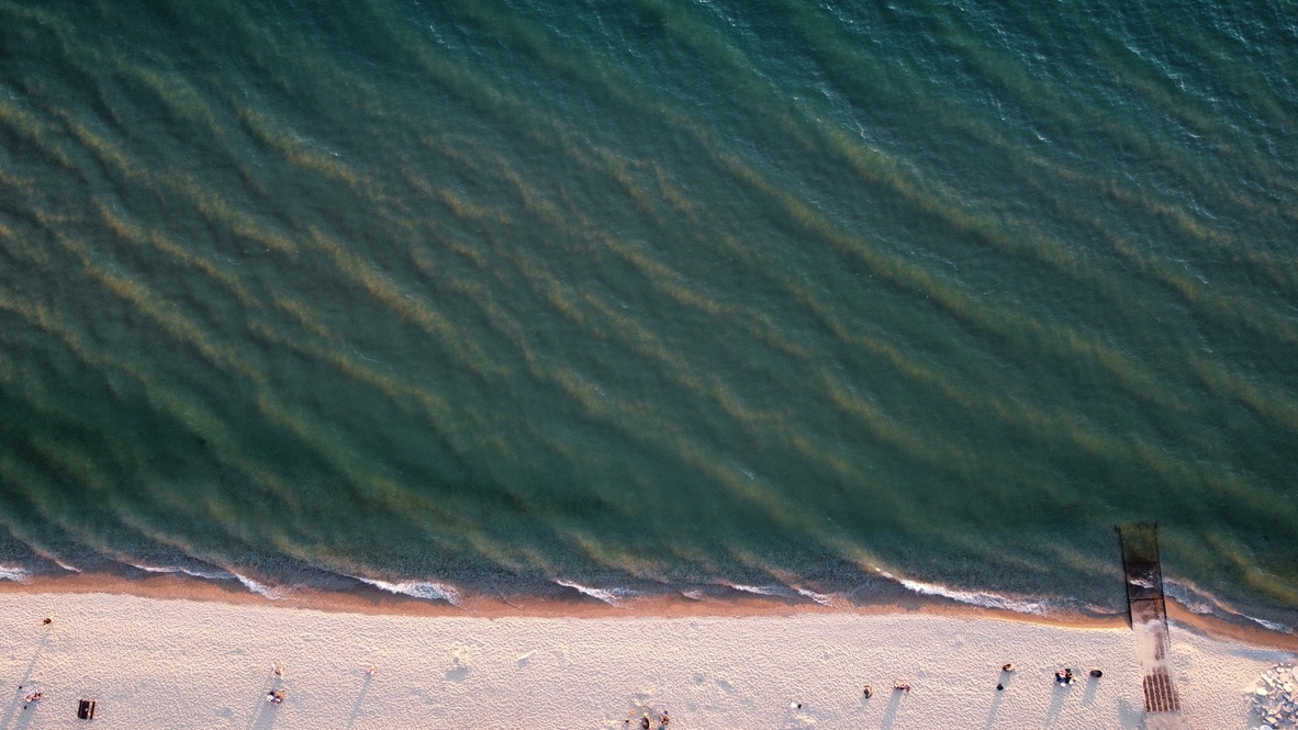 Aerial view of Empire Beach with turquoise water and golden sand