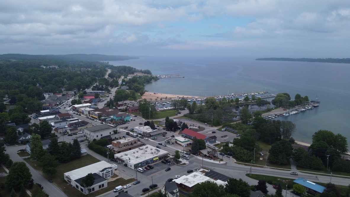 Aerial view of Suttons Bay's charming waterfront along Grand Traverse Bay