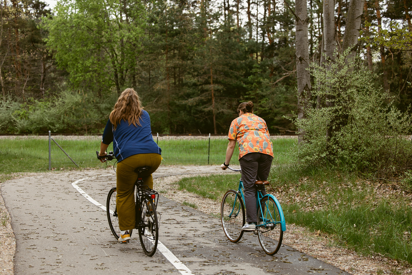 Cyclists on the TART Trail near Stone Hound Brewing